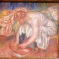 Femme laçant sa chaussure. Pierre Auguste Renoir.
